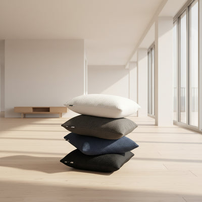 Two white Cusheez pillows by Phaf stacked on a surface with a neutral background.