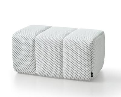White Toto Ottoman by Phaf featuring a soft cushioned top and wooden legs, ideal for living room or bedroom decor.