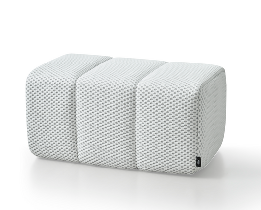 White Toto Ottoman by Phaf featuring a soft cushioned top and wooden legs, ideal for living room or bedroom decor.